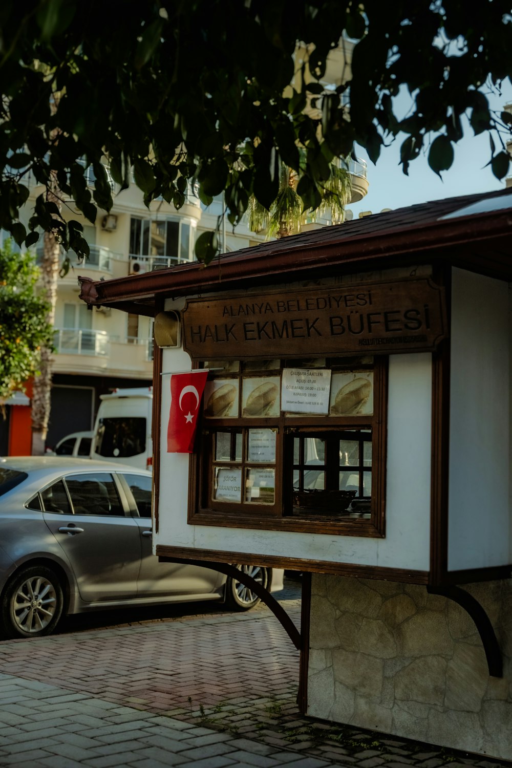 a small building with a sign on the side of it