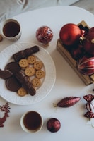 A beautifully arranged table with holiday treats and decorations.