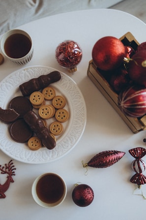 A beautifully arranged table with holiday treats and decorations.