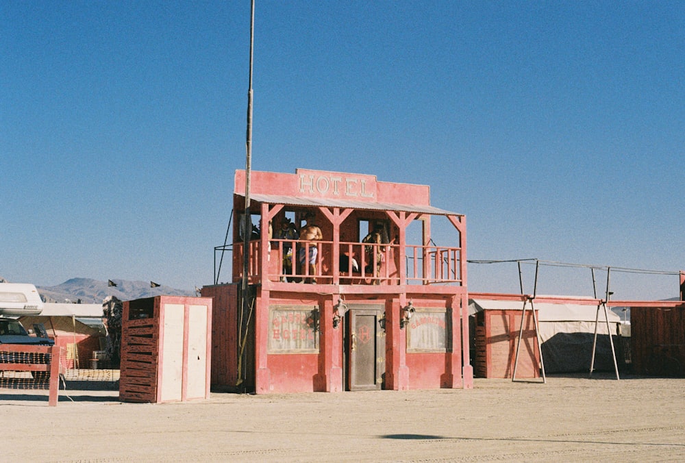 a red building with a flag on top of it