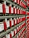 Rows of vintage electrical components with red handles and labels reading 'Cook Electric'. Each component has a label with letters and numbers.