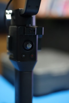 Close-up of a user pressing the push-to-talk button on a Fusion device.