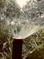 Automatic remote-controlled water monitor spraying a wide arc of water over a large area.