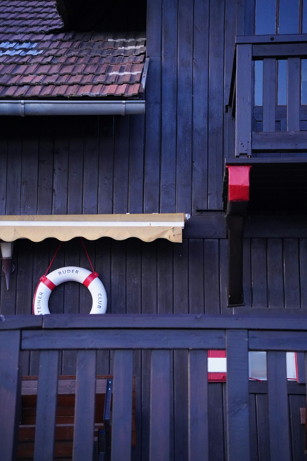 a life preserver hanging on the side of a building
