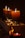 A cozy setting with beautifully lit scented candles on a table.