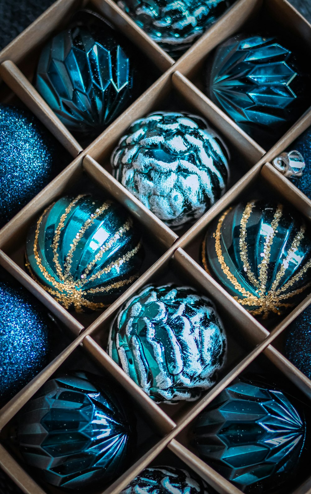 a box filled with blue and gold ornaments