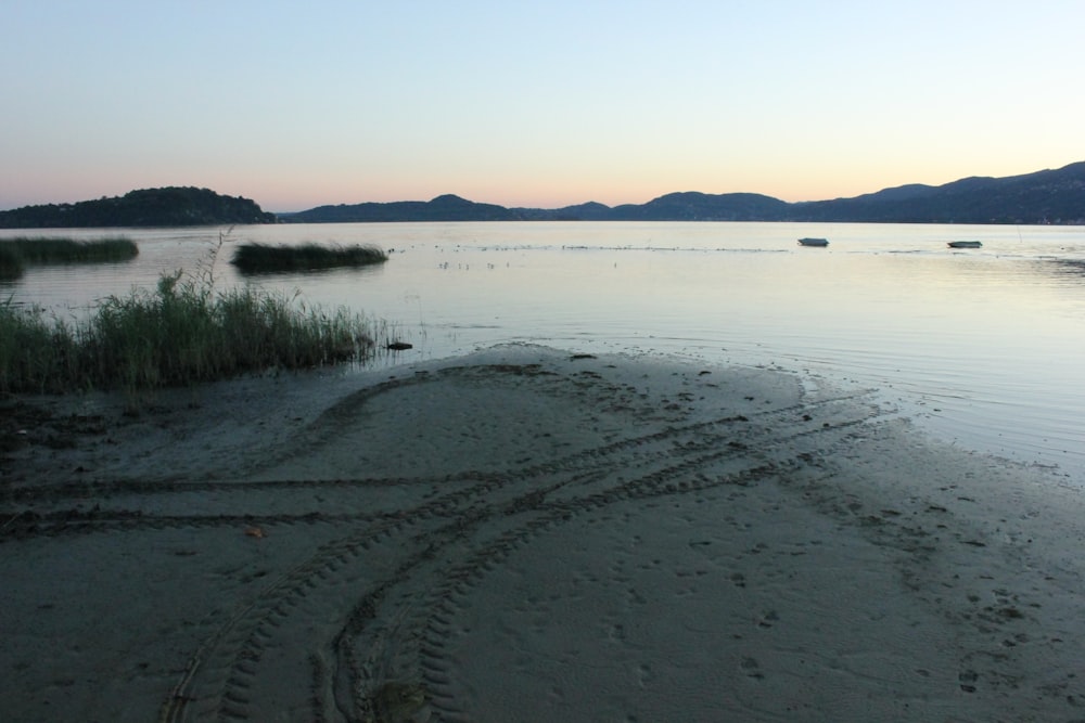 a view of a body of water at sunset