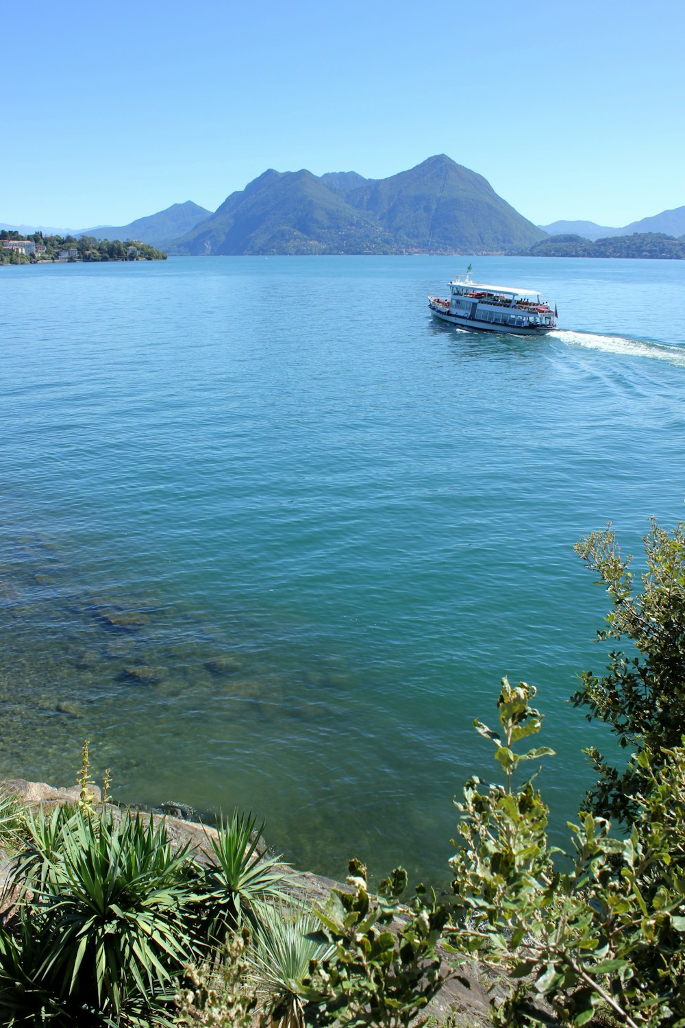 a boat traveling across a large body of water