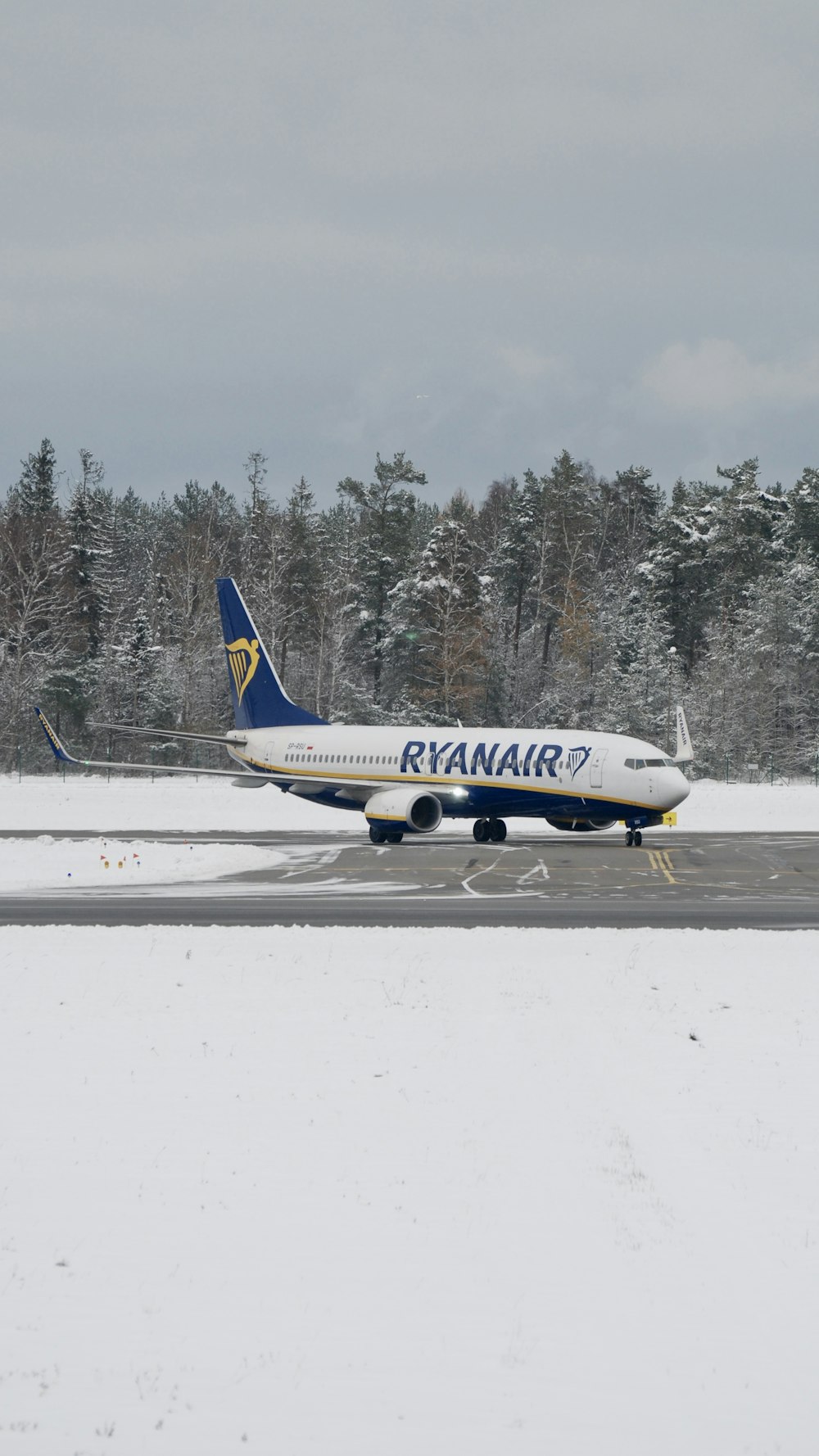 a large jetliner sitting on top of an airport runway