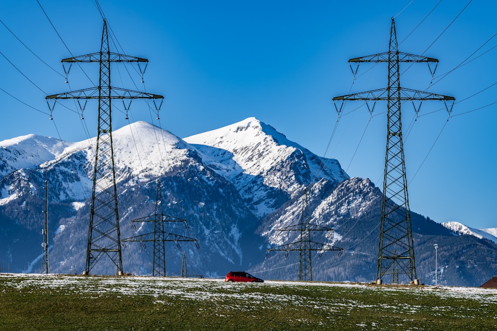 a mountain range with power lines in the foreground