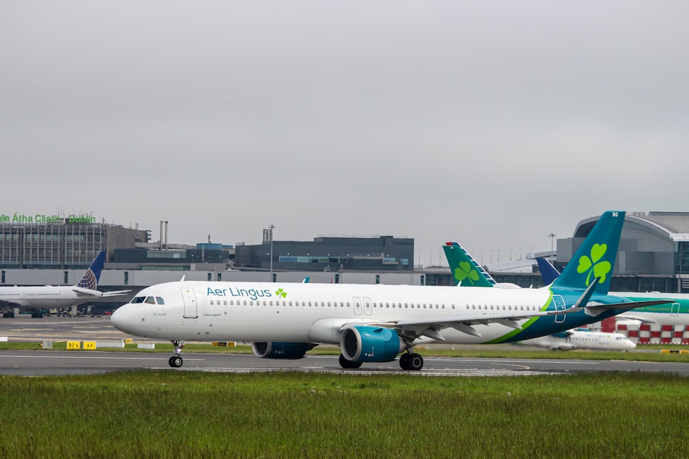 a large passenger jet sitting on top of an airport runway