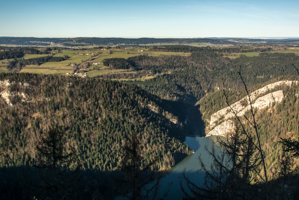 a view of a valley with a river running through it