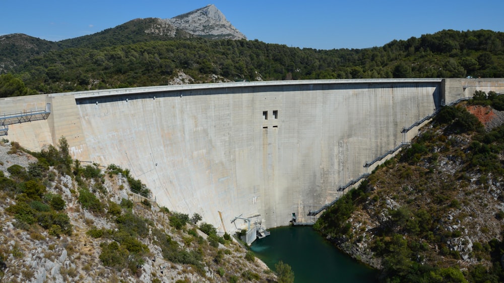 a large dam in the middle of a mountain