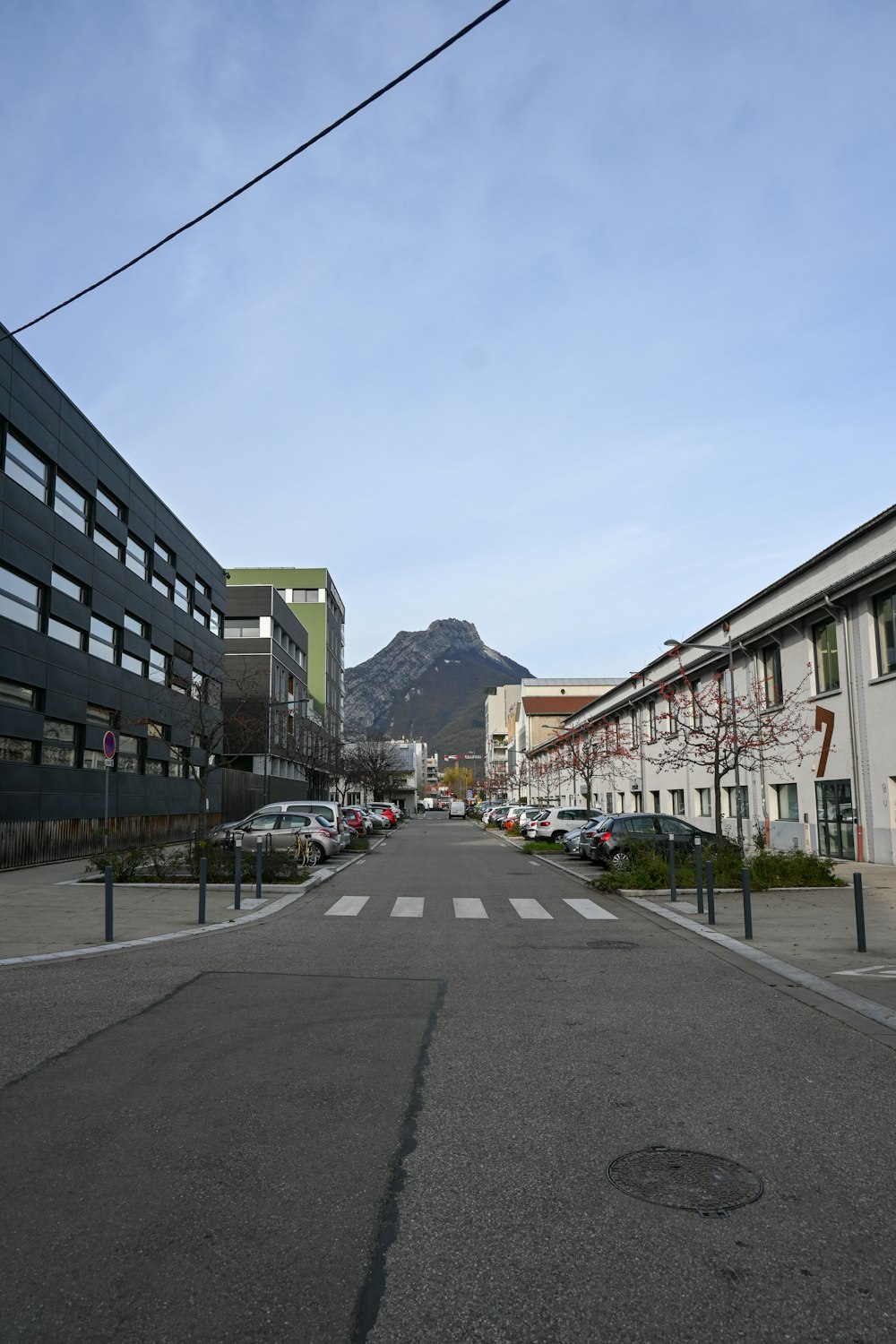 a city street with a mountain in the background