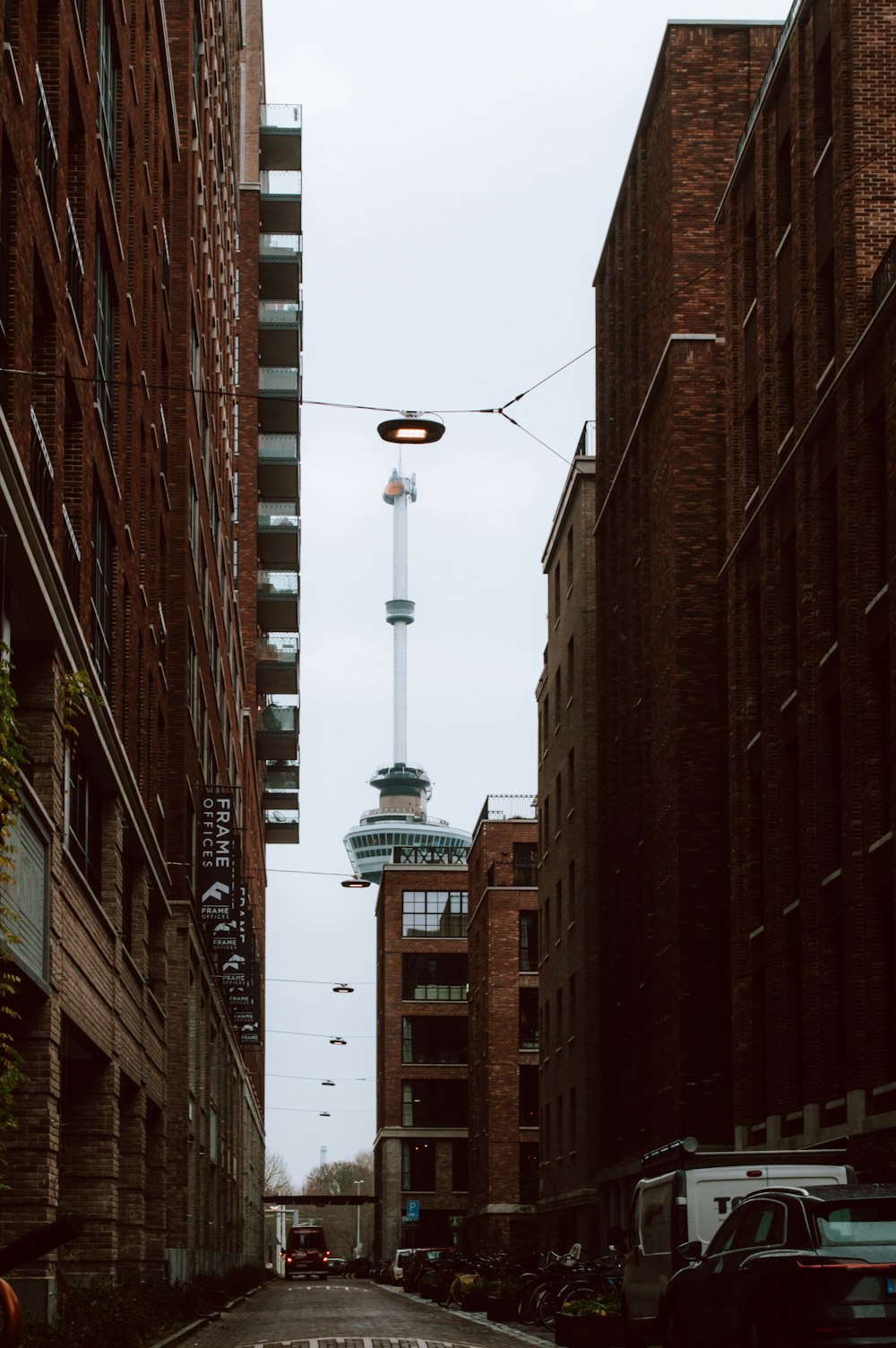 a city street with tall buildings and a street light