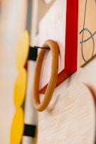 Close-up of a custom-designed accent wall with modern geometric patterns in warm earth tones.