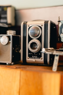Close-up of professional photography equipment displayed on a wooden shelf.