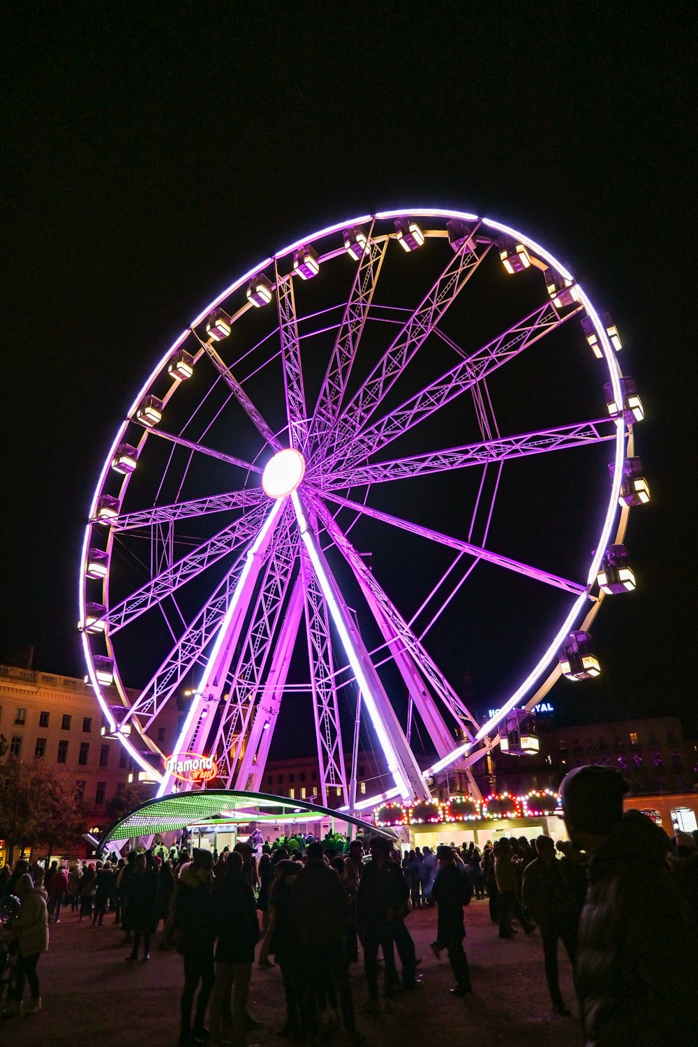 a large ferris wheel lit up at night