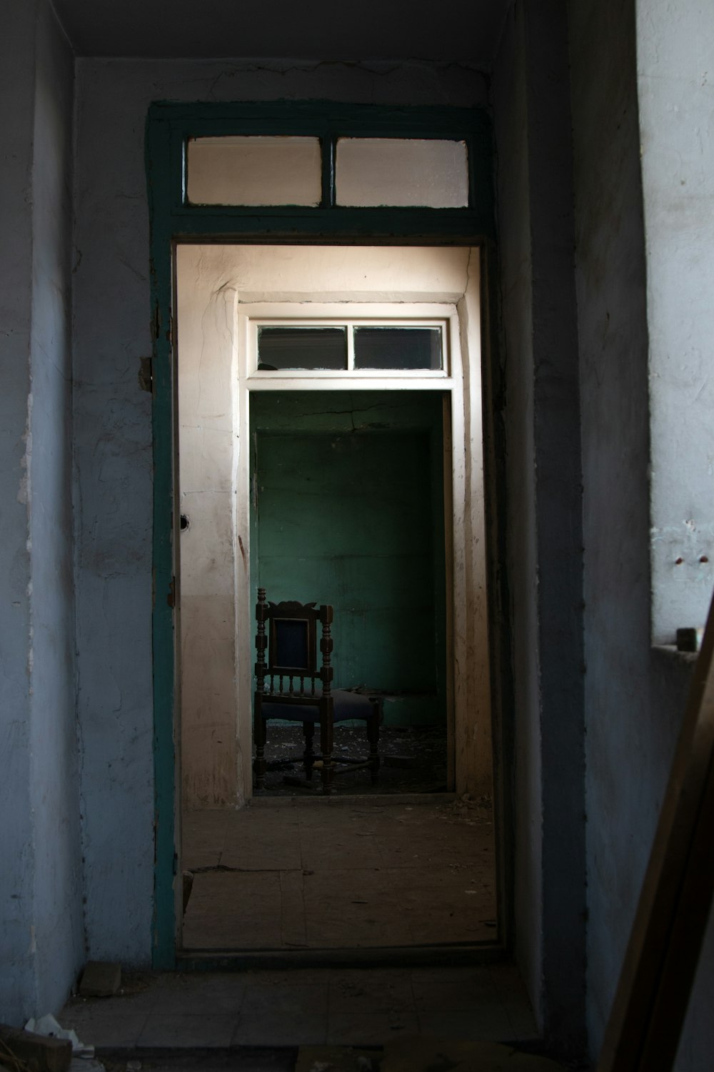 a chair sitting in a doorway of a building