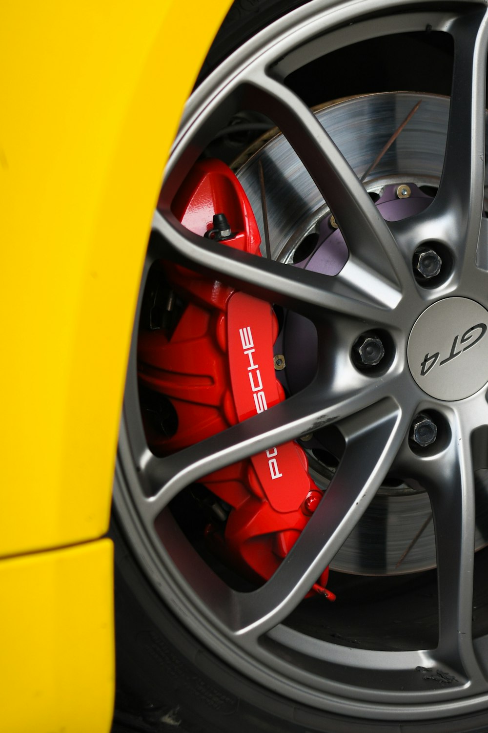 a close up of a wheel on a sports car