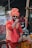 a man in a turban and sunglasses on a bike