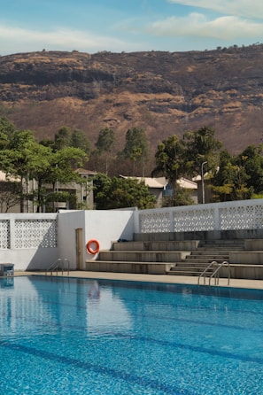 Guests taking a swim break in clear blue waters with the Toros mountains in the background.