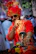 A man dressed in a crisp panjabi with a modern twist, posing near a city café.
