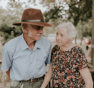 an older man and an older woman standing next to each other