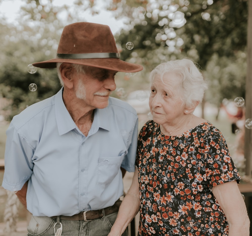 an older man and an older woman standing next to each other