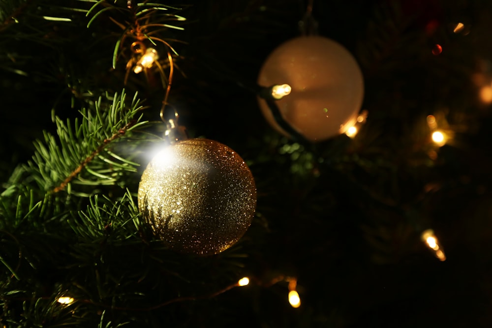 a close up of a christmas ornament on a tree