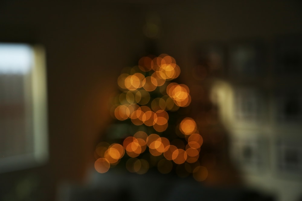 a blurry photo of a christmas tree in a living room
