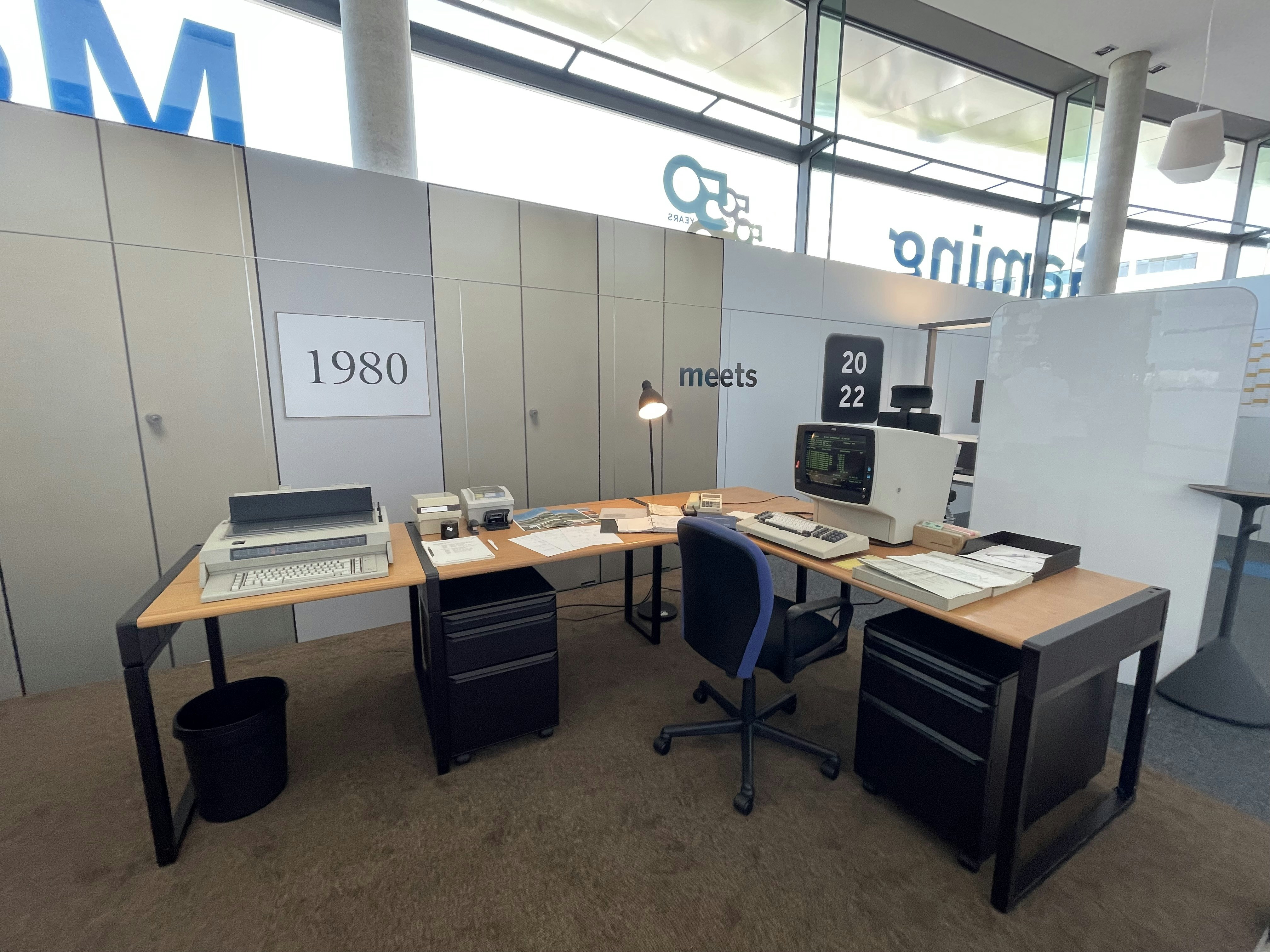 a desk with a computer and a monitor on it
