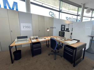 a desk with a computer and a monitor on it