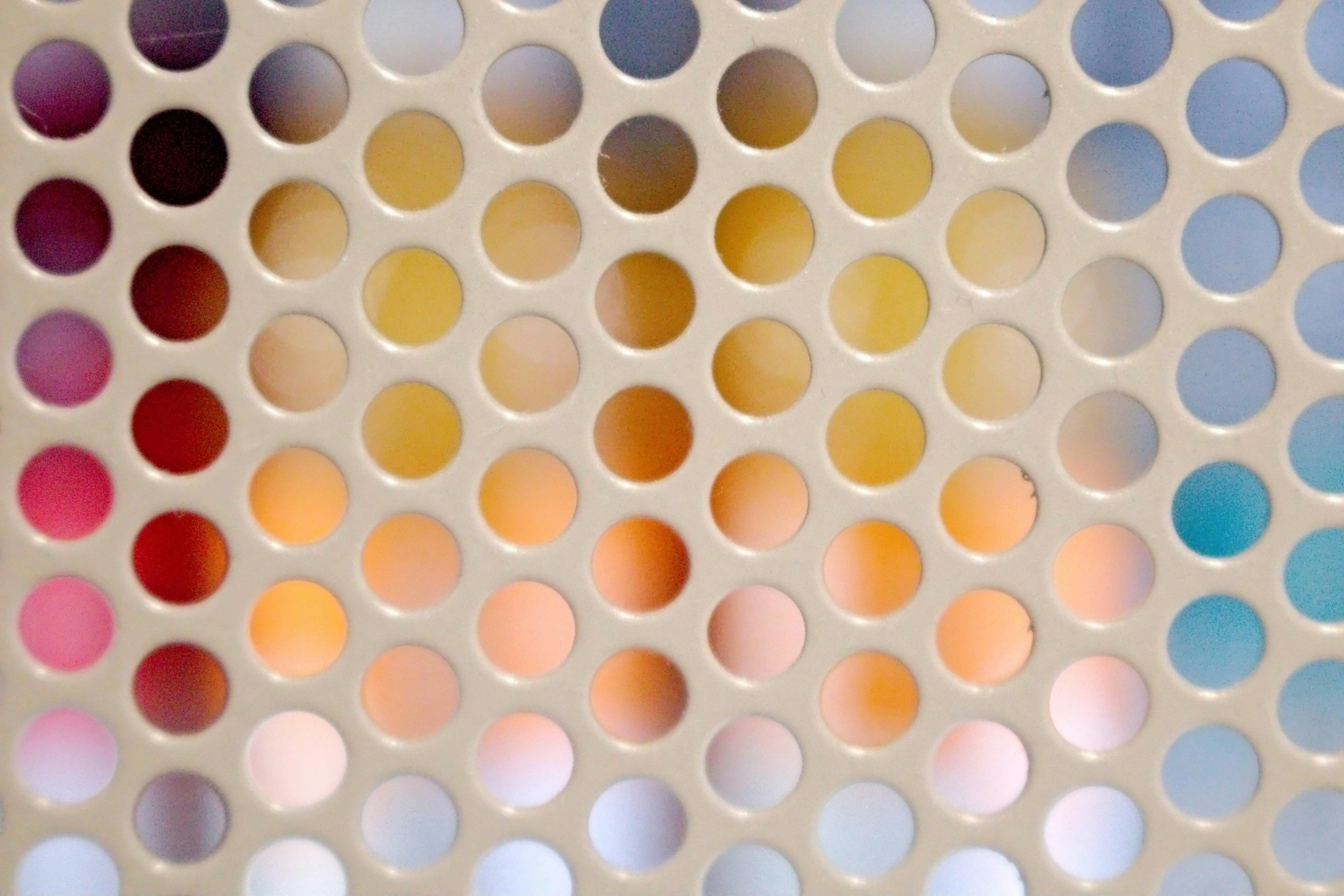 a close up view of a multicolored wall