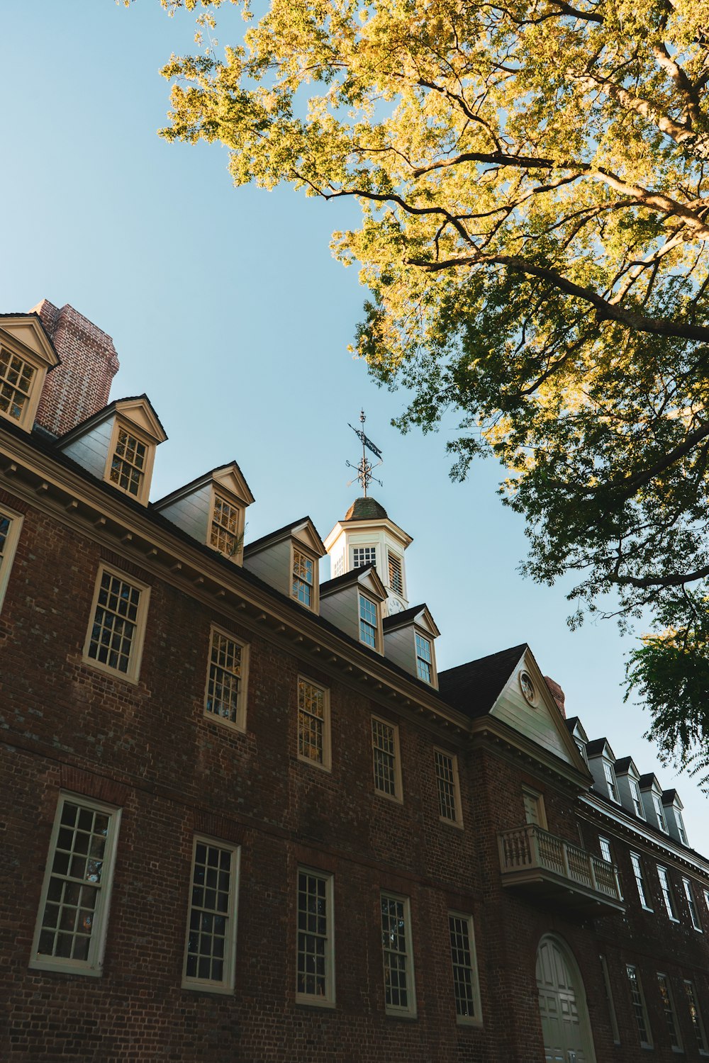 a tall brick building with a clock tower on top