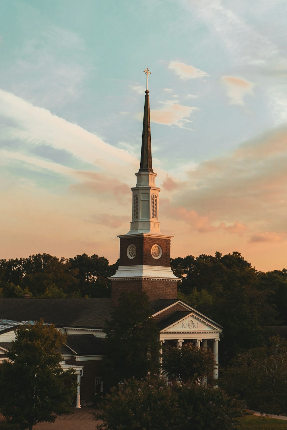 a church steeple with a clock on it