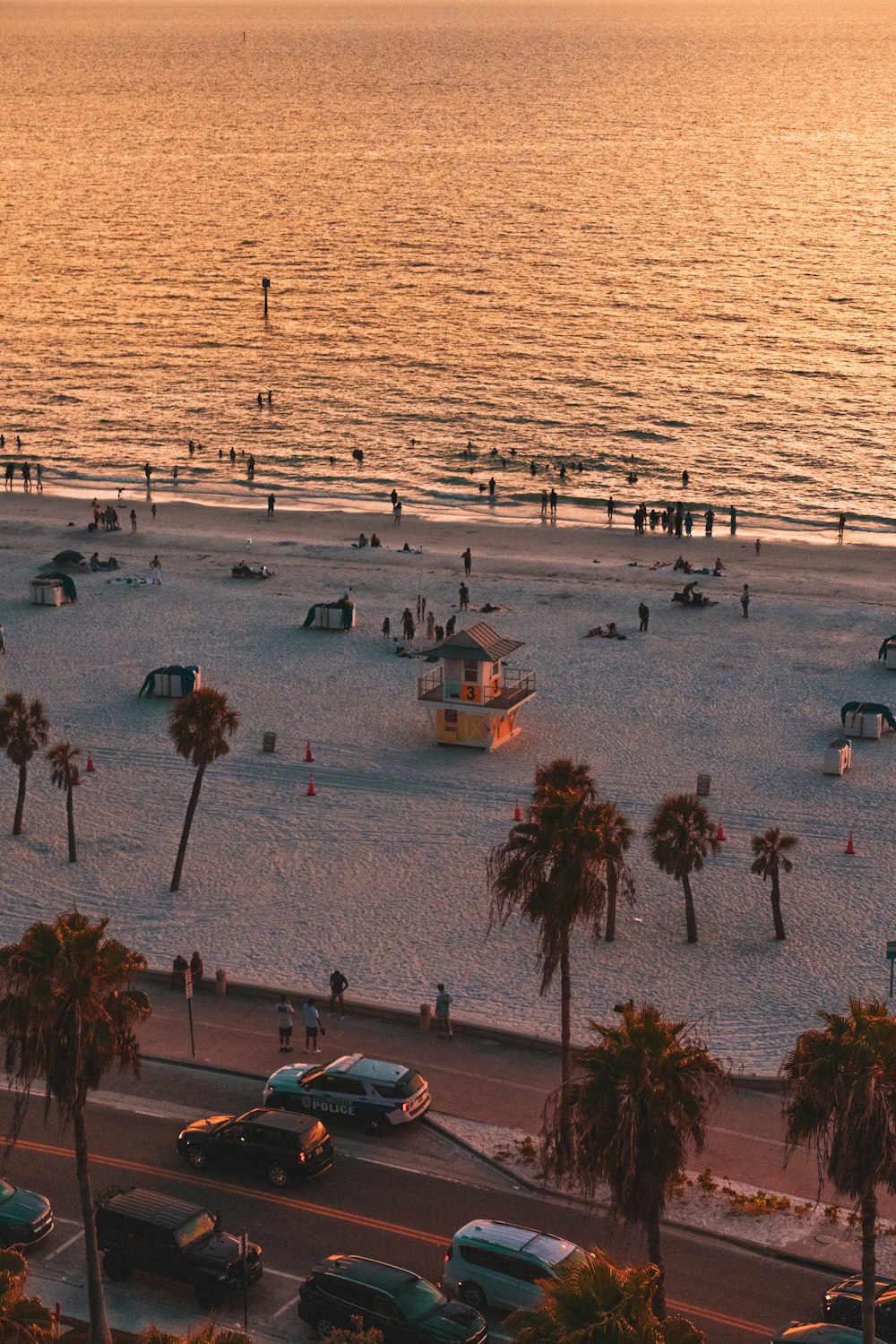 a beach with a lot of cars parked on it