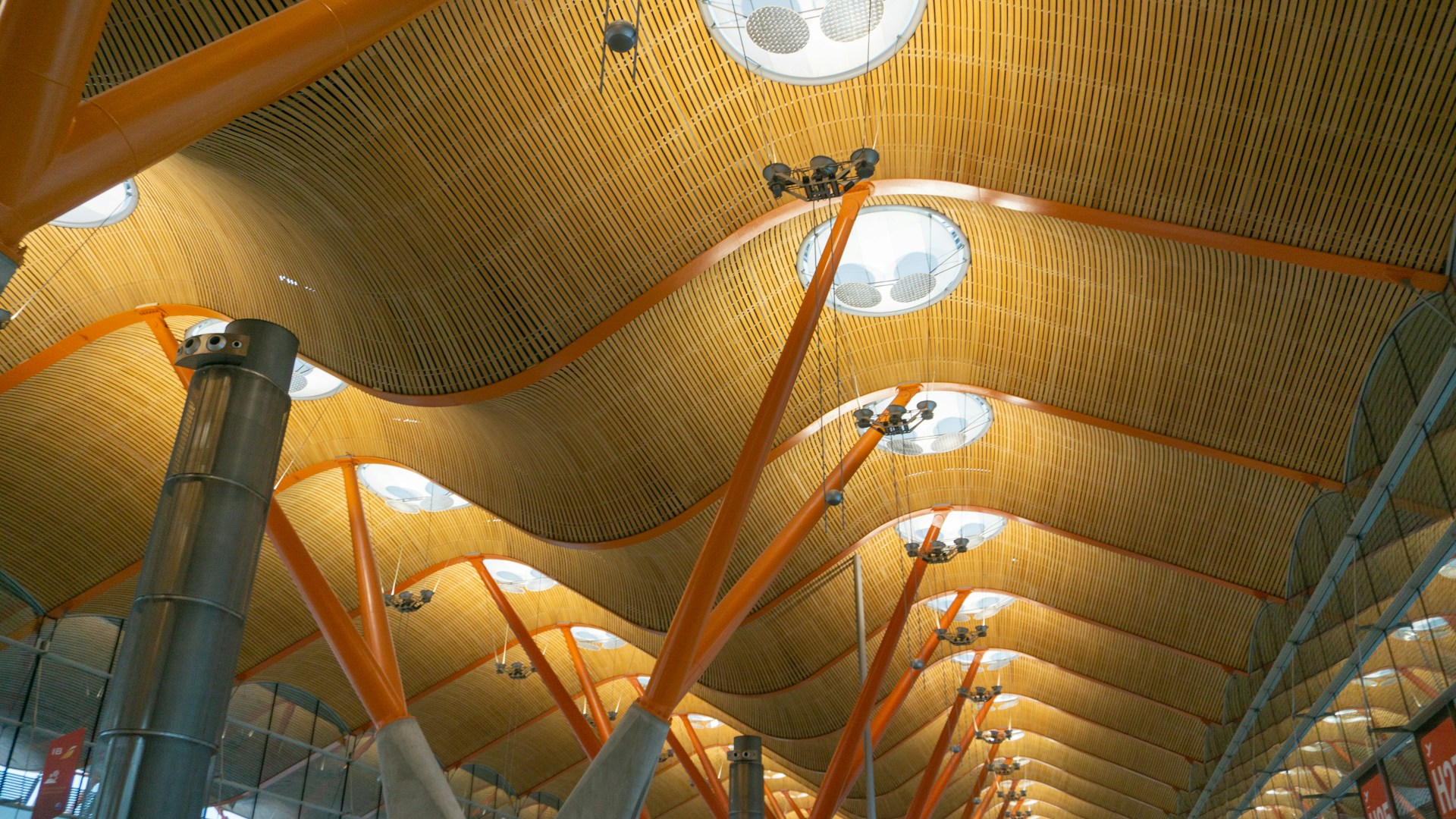 the ceiling of a train station with many lights