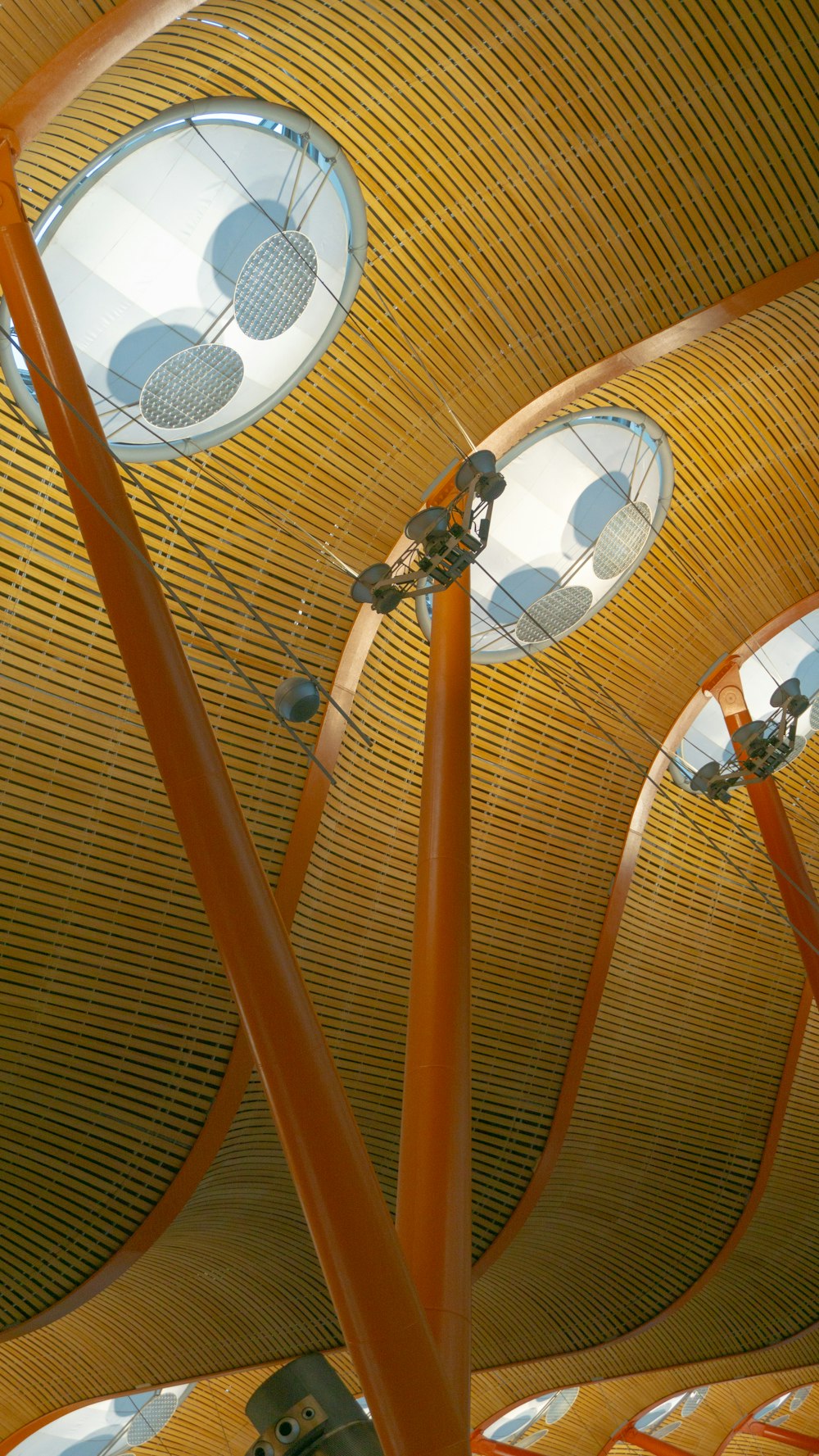 the ceiling of a building with multiple round windows