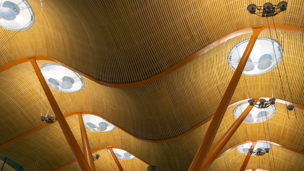 the ceiling of a building with a lot of lights