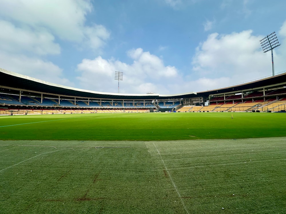 an empty soccer field with a sky background