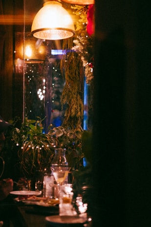 Warm ambient lighting highlighting the cozy interior filled with happy diners