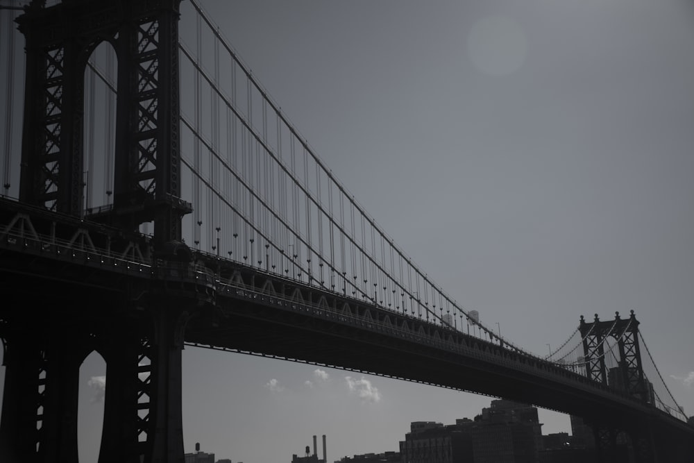 a black and white photo of the brooklyn bridge