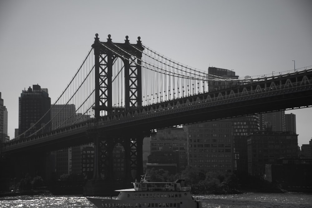 a boat is going under a bridge in the water