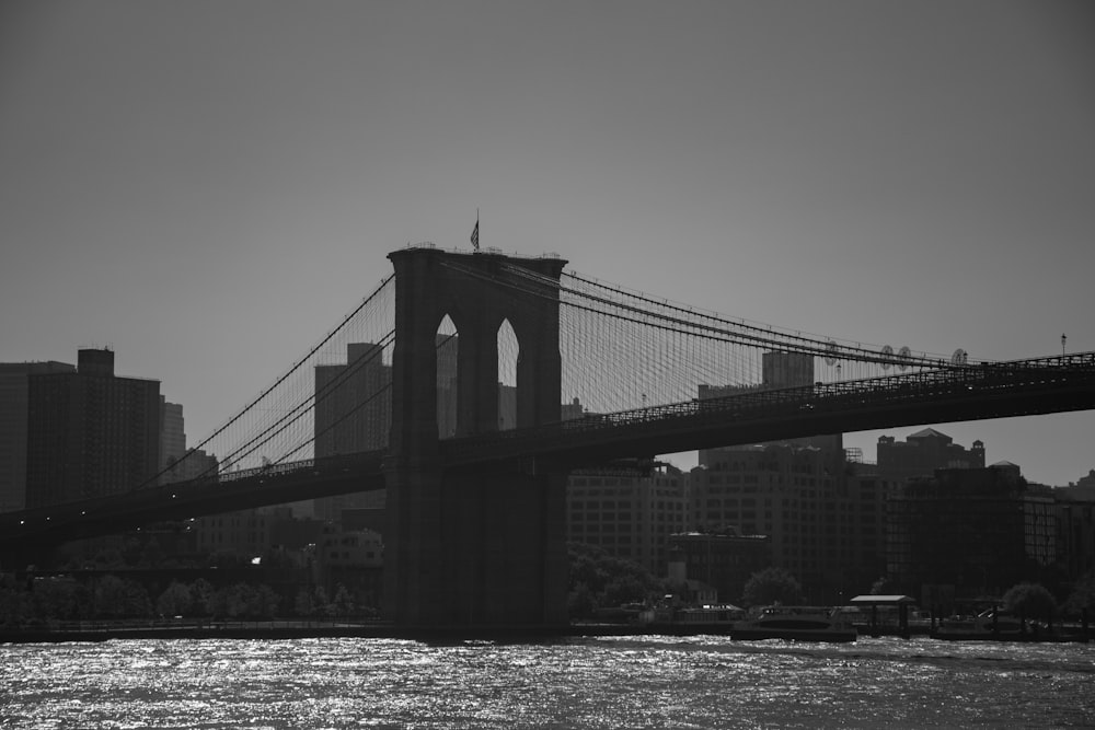 a black and white photo of the brooklyn bridge