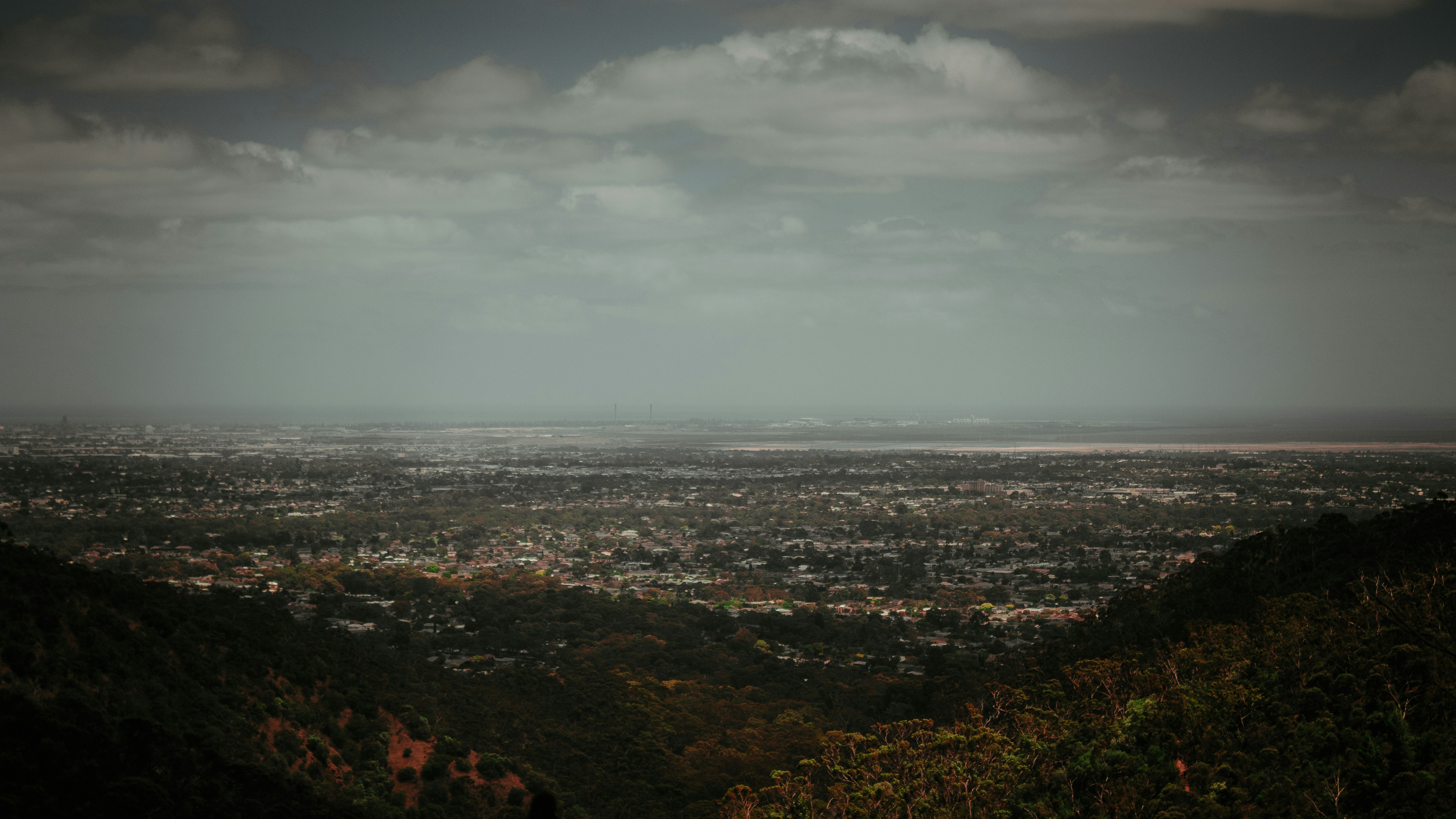 a view of a city from the top of a hill