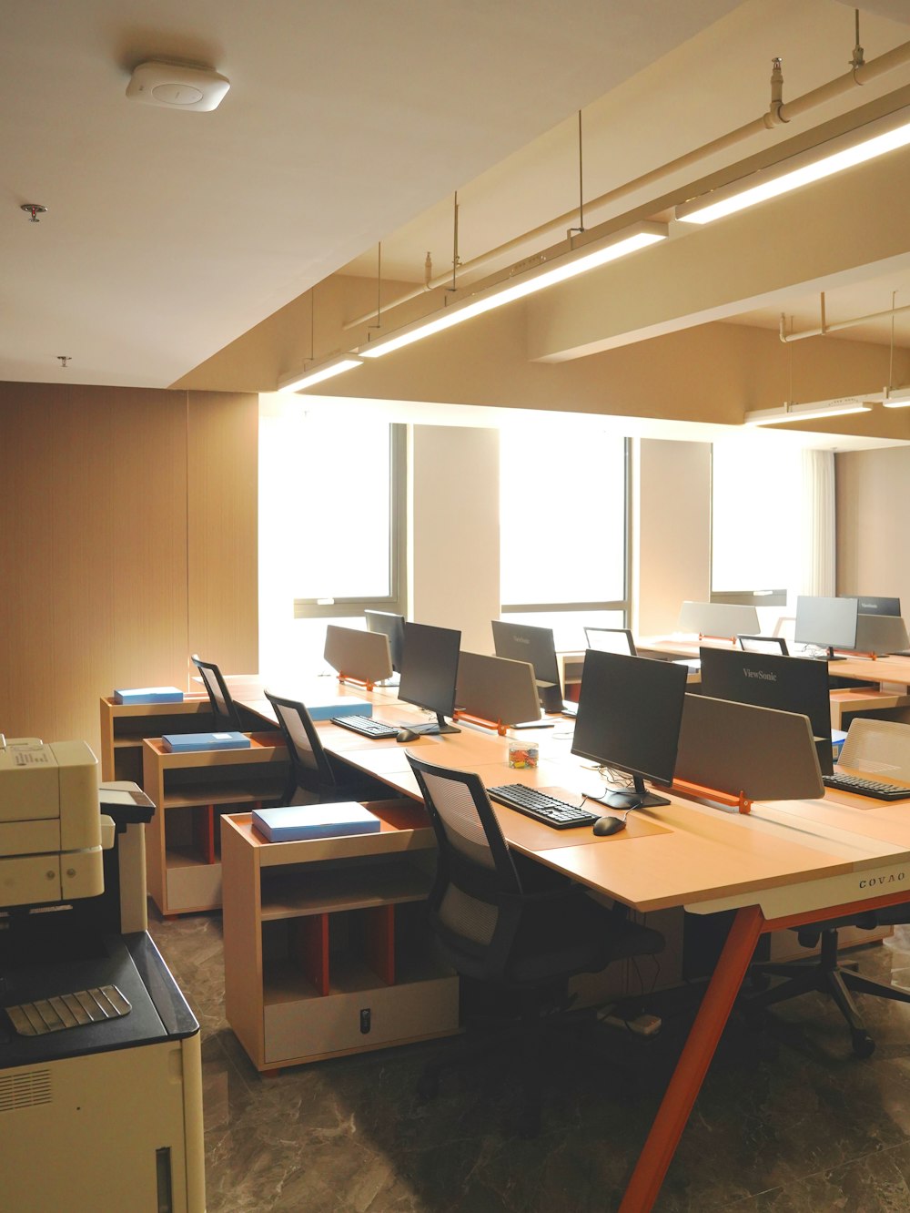 a room filled with lots of computers and desks