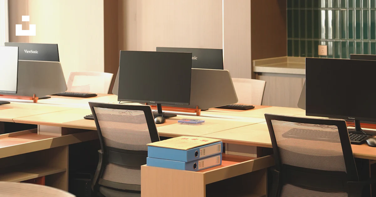 Top Bottom Computer A row of laptop computers sitting on top of desks photo – Free Table ...