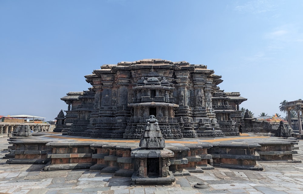 a stone structure with a statue on top of it