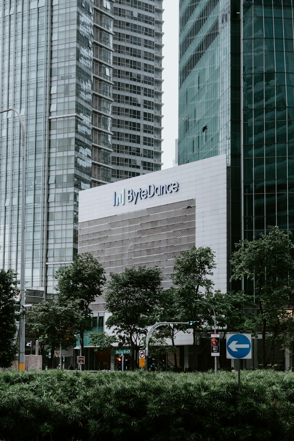 a tall building with a sign in front of it